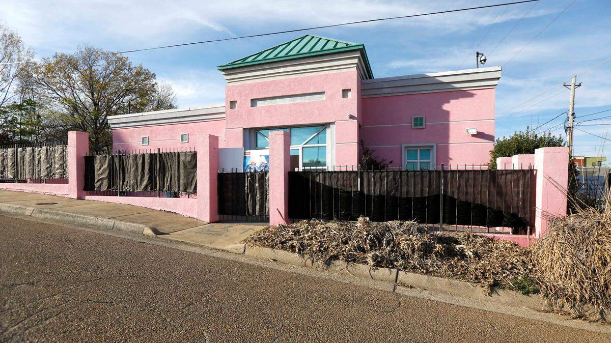 FILE - Dead razor grass and masked fencing sits at the entrance to the Jackson Women’s Health Organization clinic, the state’s only abortion clinic. JWHO successfully filed suit to block a state law that prohibits abortions after 15 weeks.
