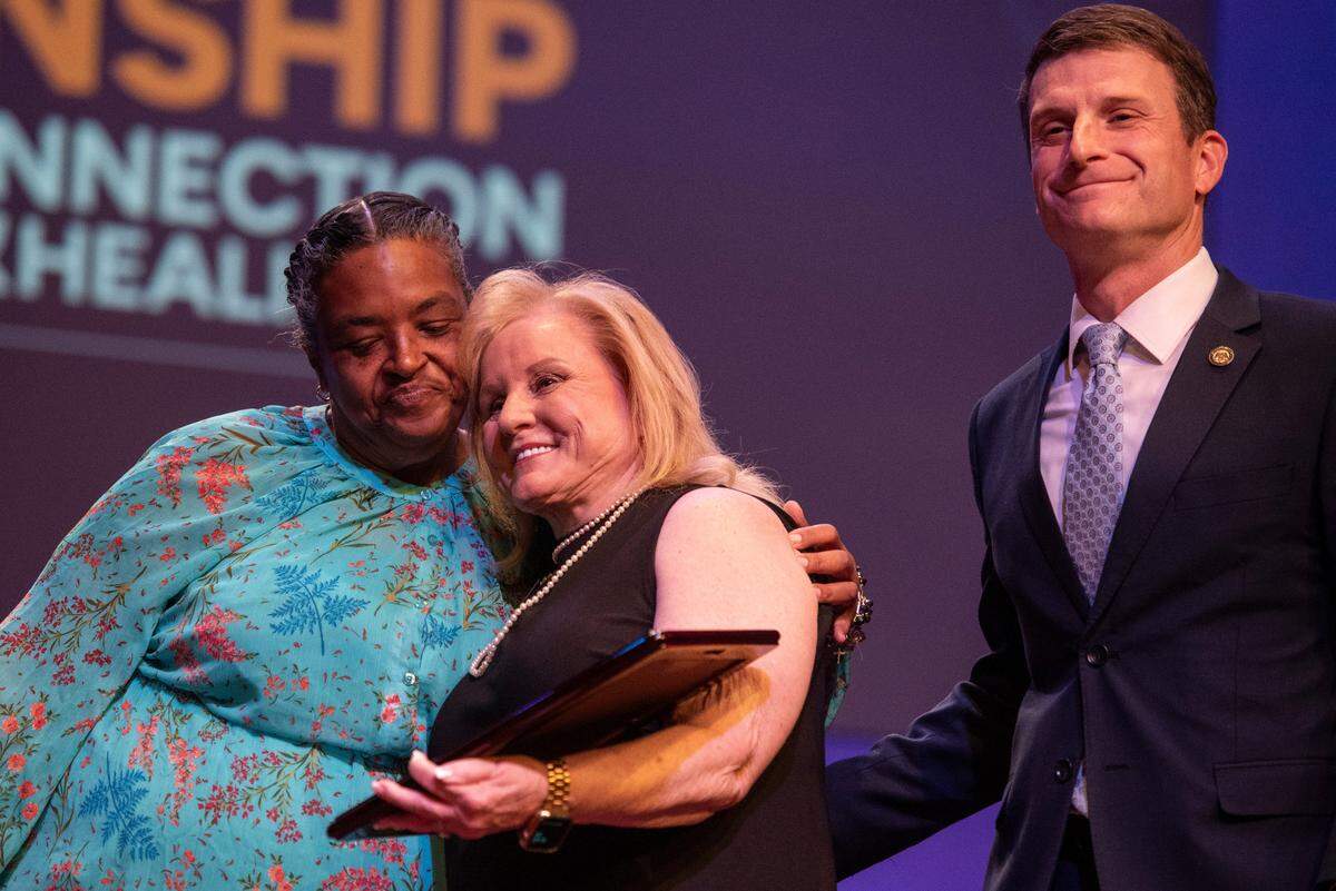 Assistant District Attorney Matthew Burrell, right, and Francine Daniels, left, present an award during a coast-wide candlelight ceremony as a part of National Crime Victims’ Rights Week at First Baptist Church of Gulfport on Tuesday, April 29, 2025.
