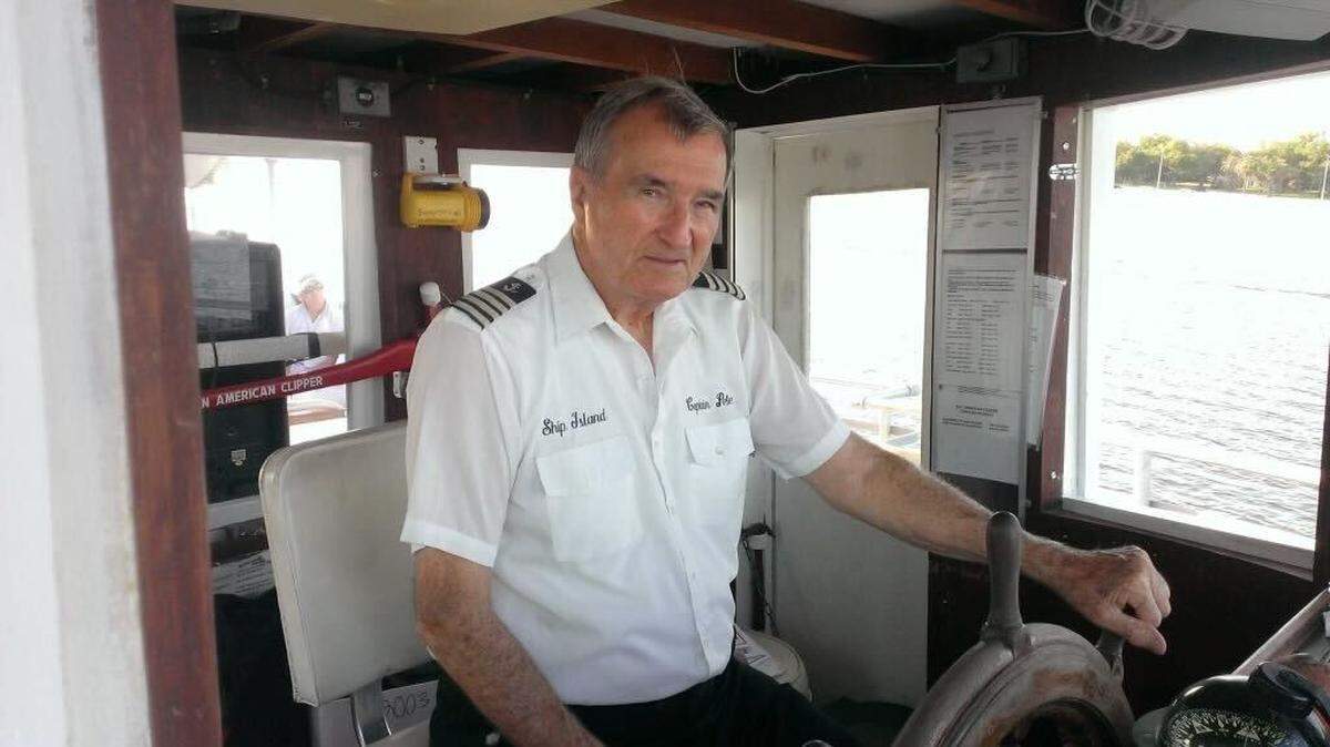 Capt. Pete sits at the helm of a ship.