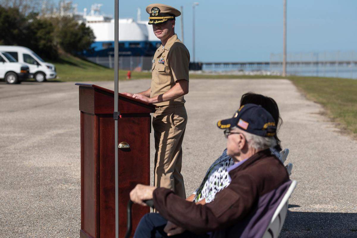 Commander Ryan McGoldrick gives a speech about WWII veteran Alfred Lewis during a ceremony in honor of Lewis and the Iwo Jima anniversary at Singing River Island in Pascagoula on Saturday, March 22, 2025.
