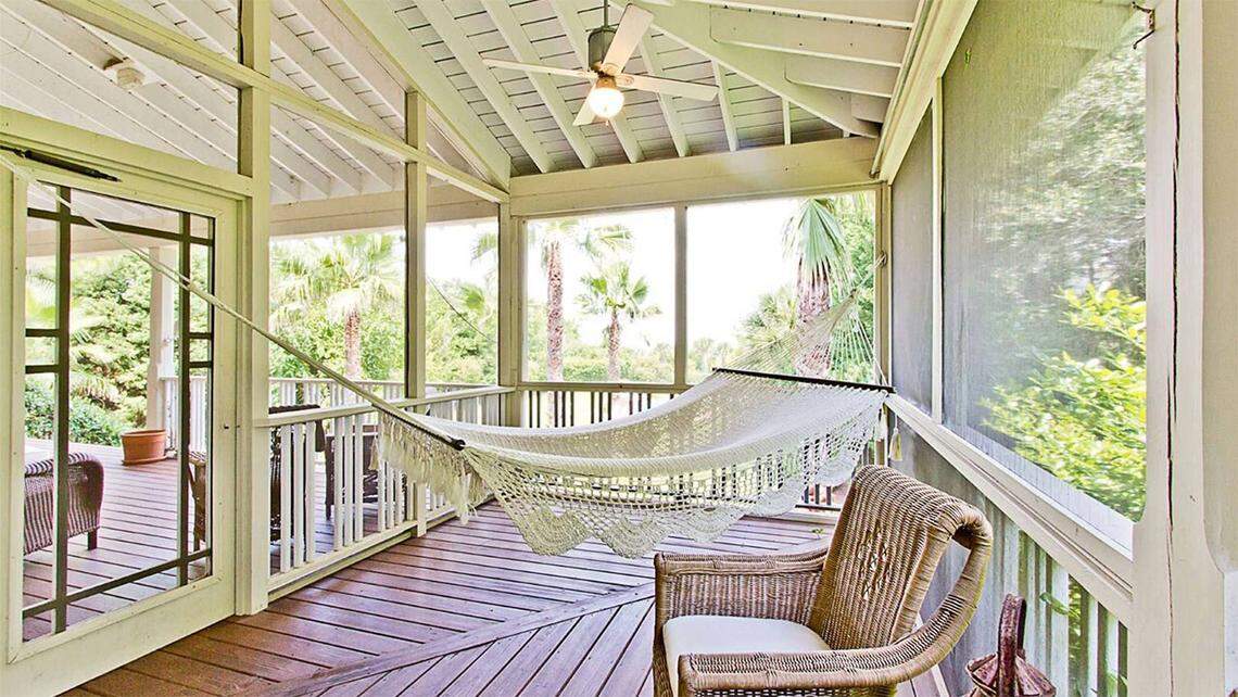 The main house features several screened porches that offer picturesque ocean views.