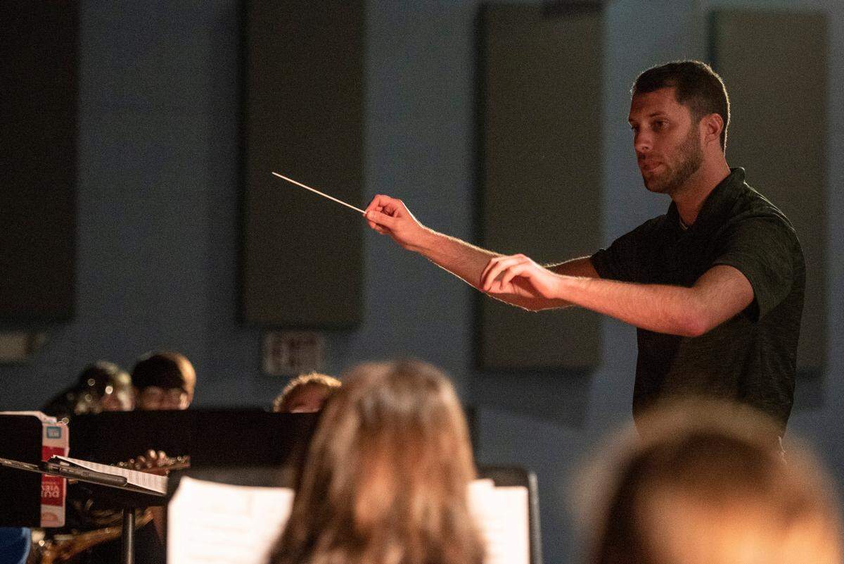 Band director Eric Fry conducts the Bay High band during class at Bay High School in Bay St. Louis on Tuesday, March 22, 2022. Bay High’s band will get updated facilities and a practice field if the bond passes.