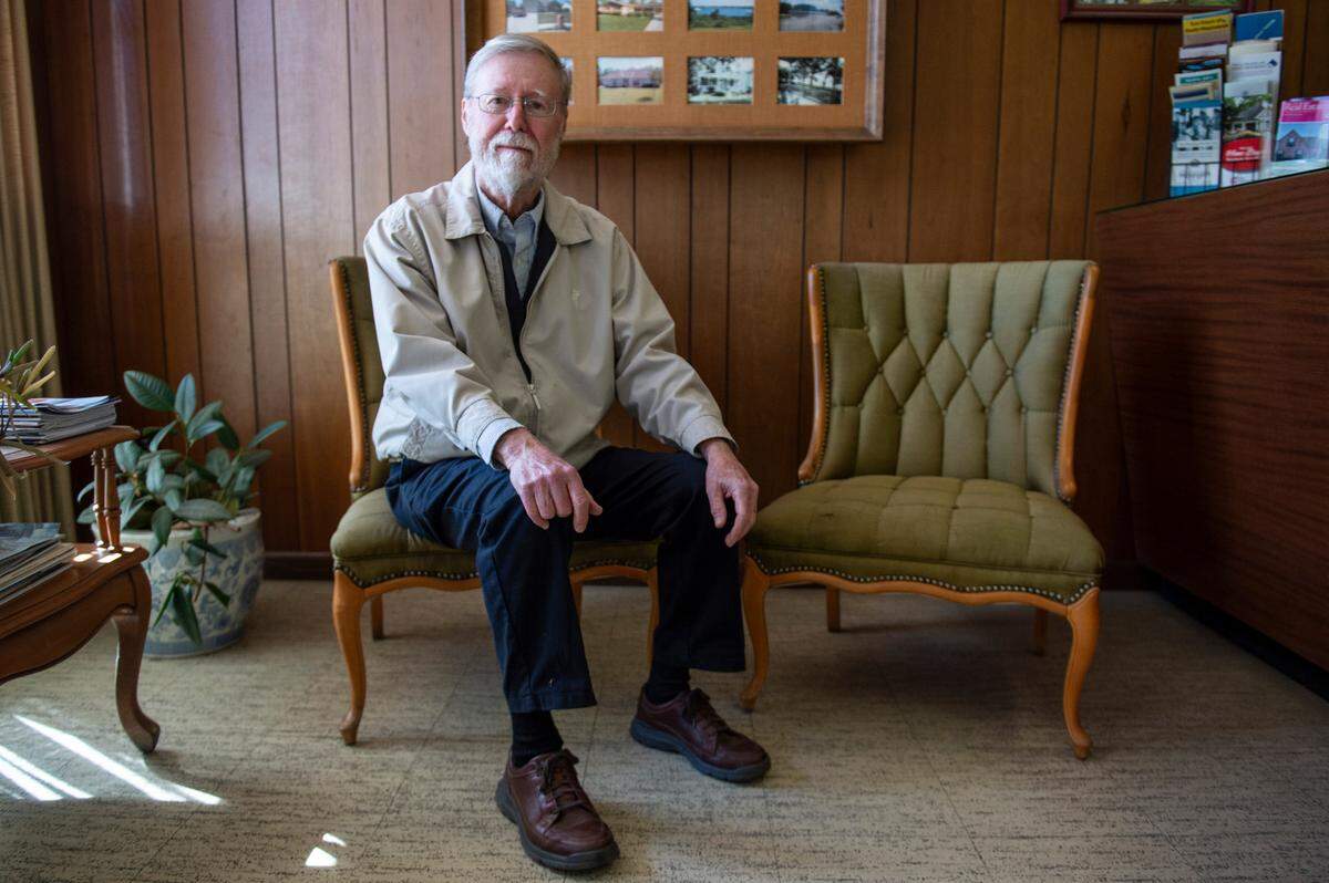 Milton Grishman sits in the real estate office that his father purchased in 1966 in Biloxi on Wednesday, Feb. 9, 2022. The office survived Katrina, but now an infrastructure project started after the fact has caused extensive damage to the building including a cracked foundation.
