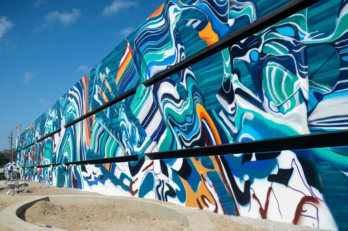 A mural by Douglas Hoekzema, also known as Hoxxoh, decorates a parking garage at what will be the new OS 1515 development in downtown Ocean Springs on Tuesday, Oct. 29, 2024.