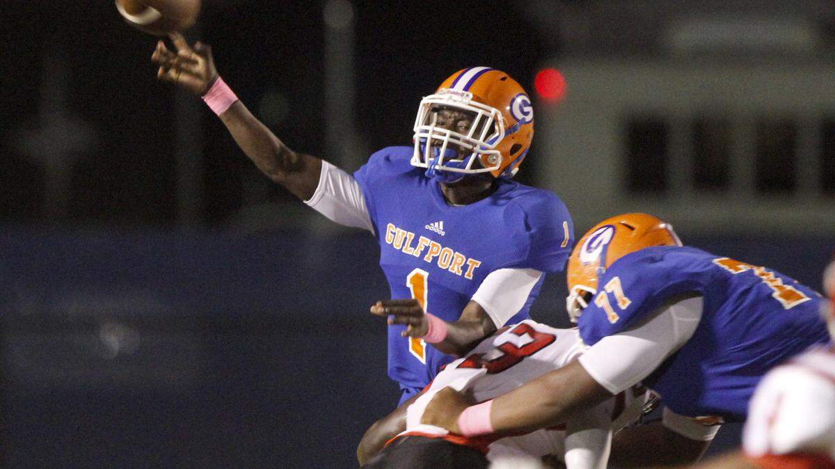 TIM ISBELL/SUN HERALD 
 Gulfport quarterback Cleveland Ford passes downfield against Harrison Central, Friday, Oct. 16, 2015.