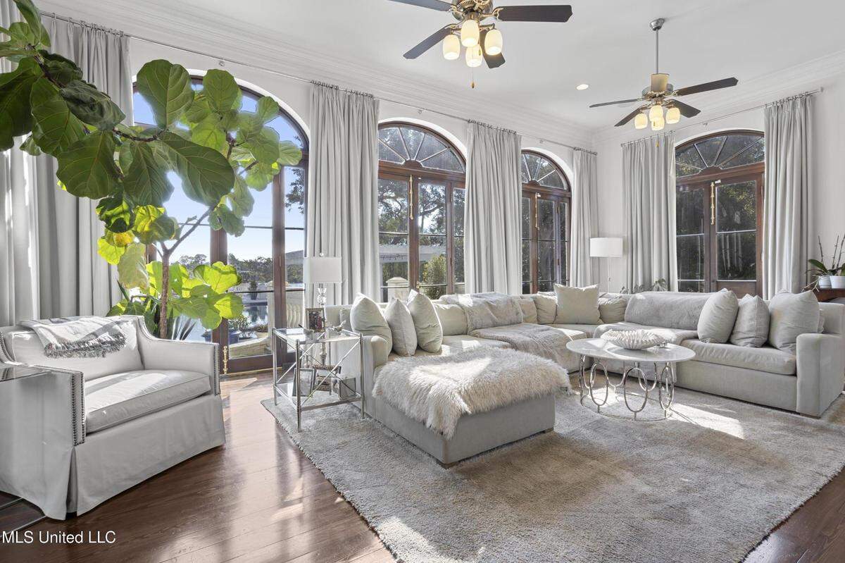 A waterfront mansion on the market in Gulfport includes expansive windows throughout.