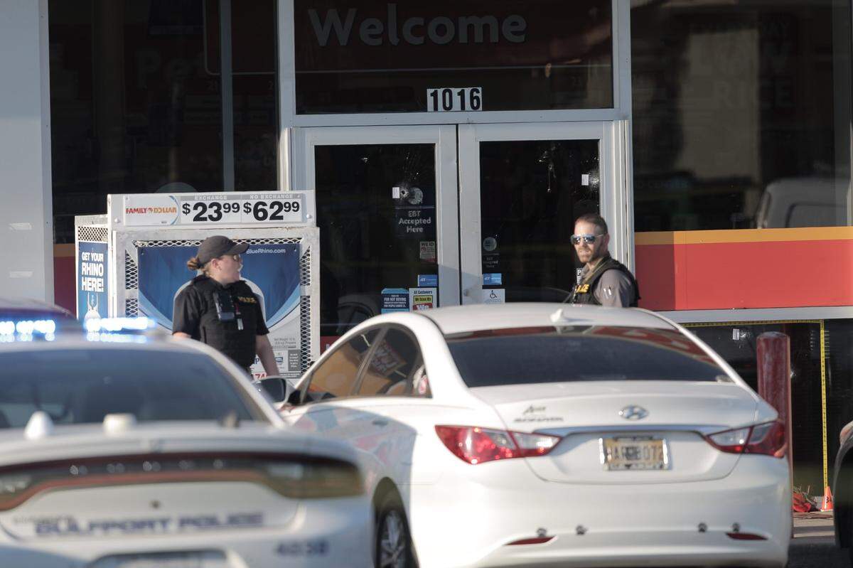 Two bullet holes can be seen on the doors of the Family Dollar store on Pass Road in Gulfport after an officer-involved shooting on October 6, 2022.