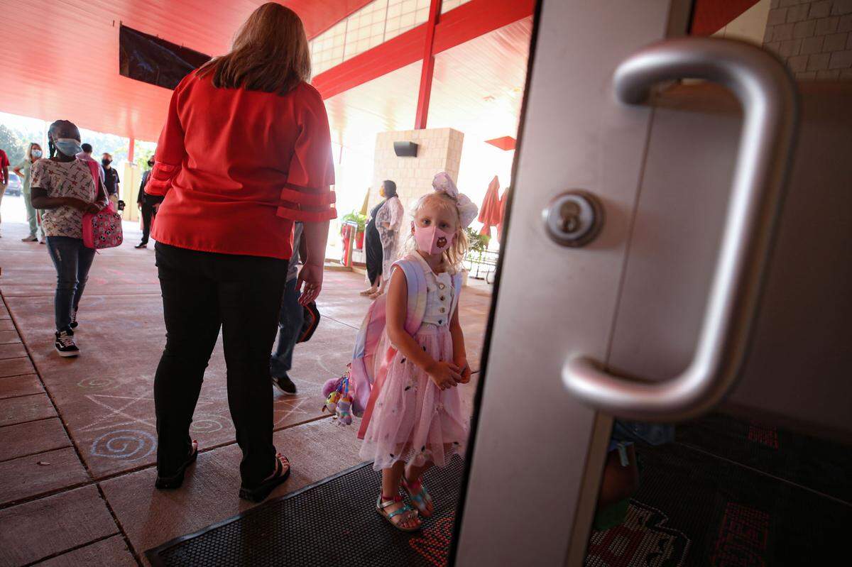A North Bay Elementary student looks at the camera before walking through the front doors on the first day of school August 5, 2020.