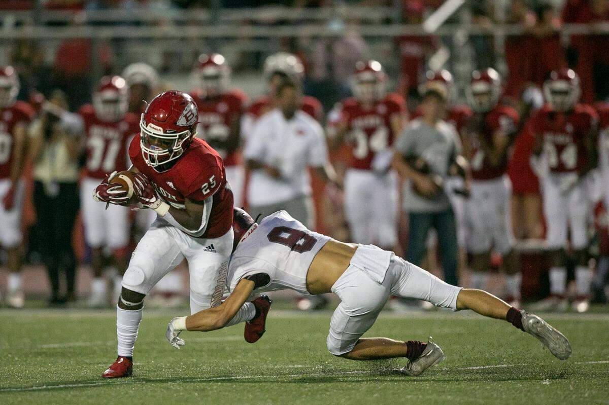 Biloxi’s Chris Norwood is tackled by East Central’s Carson Ryder during the Biloxi versus East Central football game at Biloxi High School on Friday, Aug. 27, 2021.