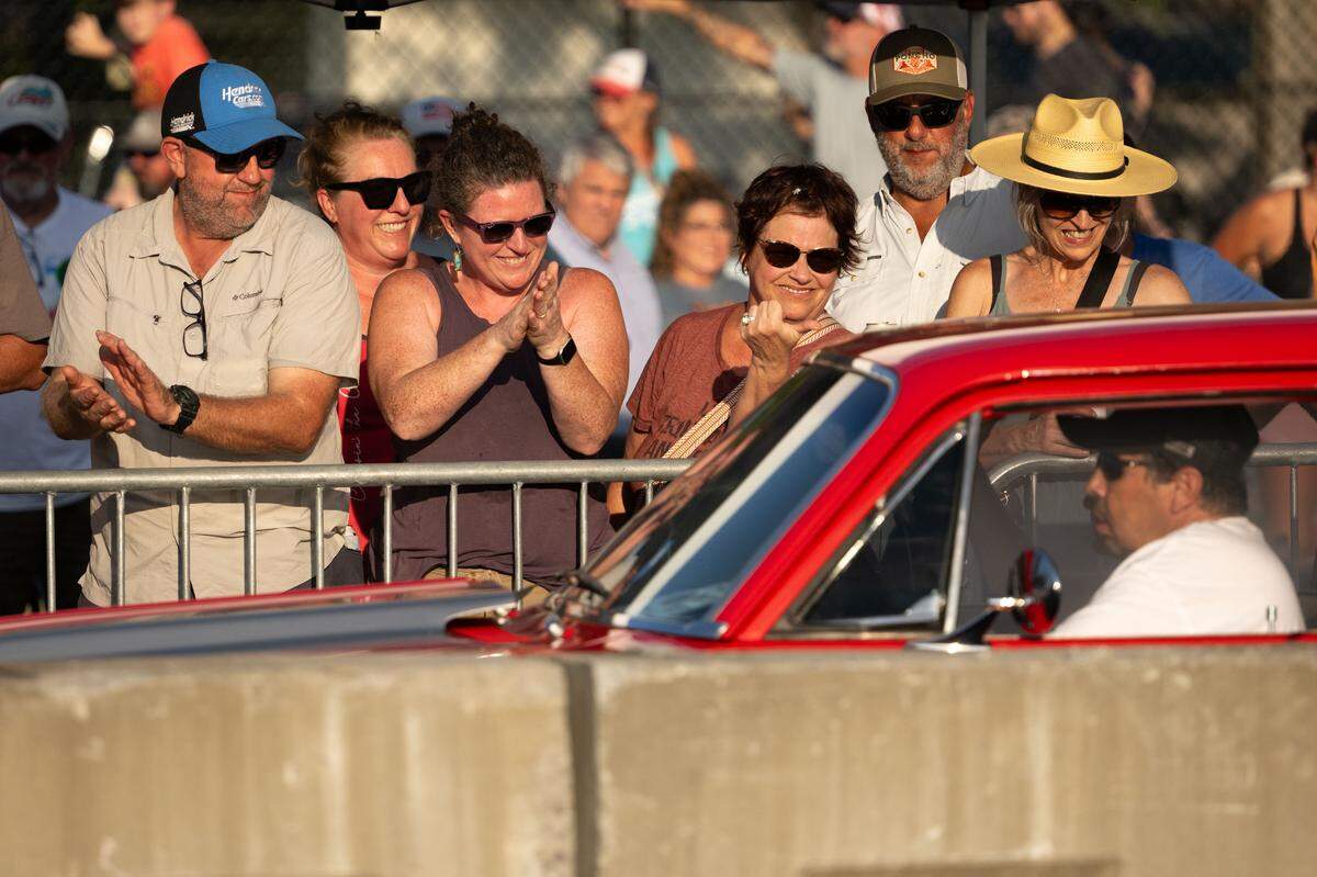 Thec crowd claps after a car burns out during Burn ‘Em Up In The Pass on Thursday, Oct. 9, 2025.