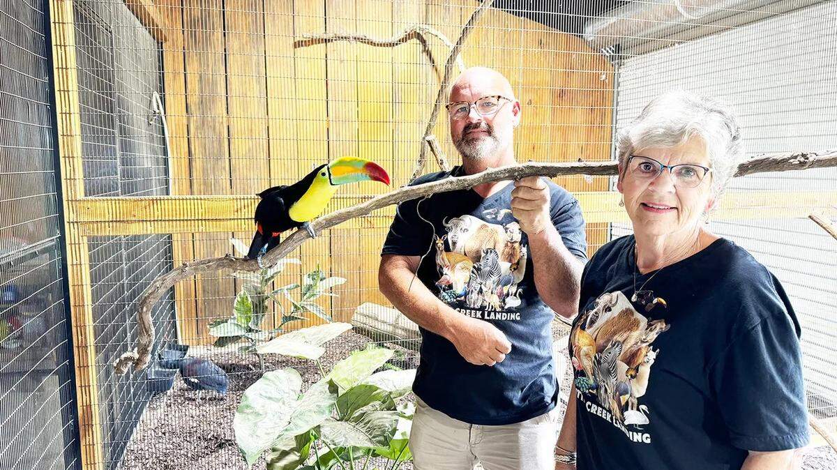 Chris Thurman and Joy Thurman Wallace pose with a toucan, which is one of more than 300 exotic animals at the Little Creek Landing Safari Park in Hattiesburg.