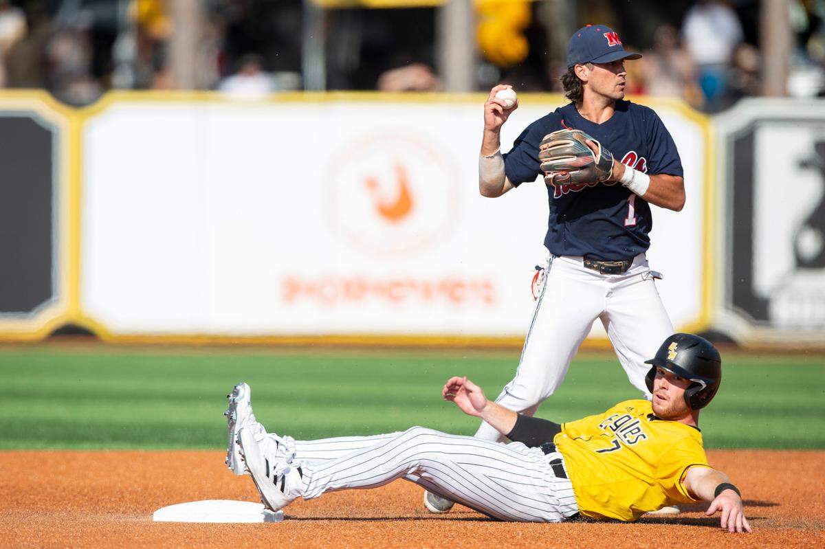 Southern Miss’s Slade Wilks is out as he slides into second base after the ball during the Super Regionals Final at Pete Taylor Park in Hattiesburg on Sunday, June 12, 2022.