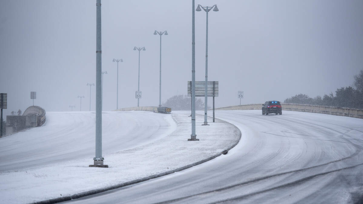 Police close off the Ocean Springs-Biloxi bridge due to snow on Tuesday, Jan. 21, 2025.