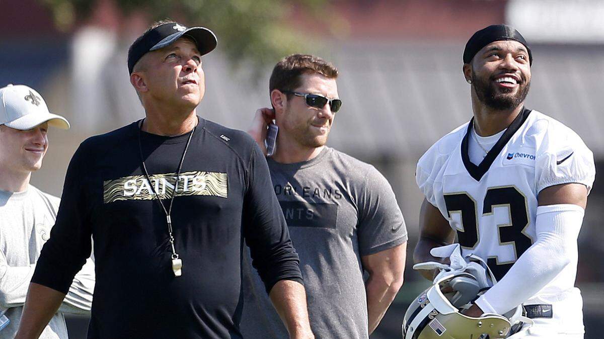 New Orleans Saints head coach Sean Payton and cornerback Marshon Lattimore (23) look on during practice in Metairie, La., Thursday.