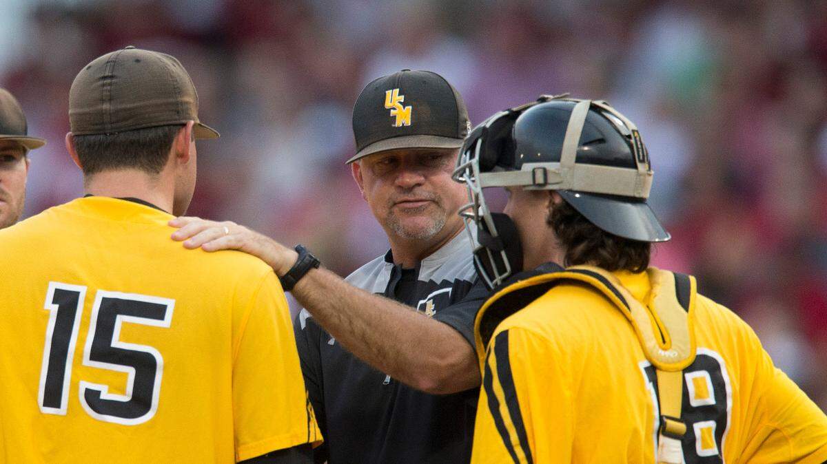 Southern Miss pitching coach Christian Ostrander visits the mound during the team’s NCAA college baseball tournament regional game against Arkansas on Saturday in Fayetteville, N.C.