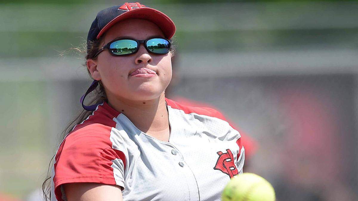 CHRIS TODD/SPECIAL TO THE SUN HERALD 
 Harrison Central's Madison Burge flips to first to retire a South Panola hitter on Thursday, May 12, 2016, the first day of the 2016 MHSAA Fast-Ptich Softball State Championships at Freedom Ridge Park in Ridgeland, Miss.
