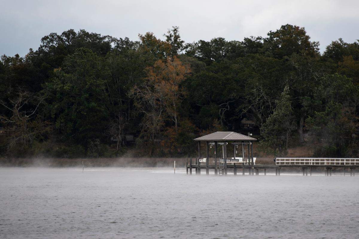 Cold air blows off the water at Fort Bayou in Ocean Springs on Tuesday, Jan. 16, 2024. Freezing rain covered plants and roads with icy overnight as temperatures dipped below freezing.