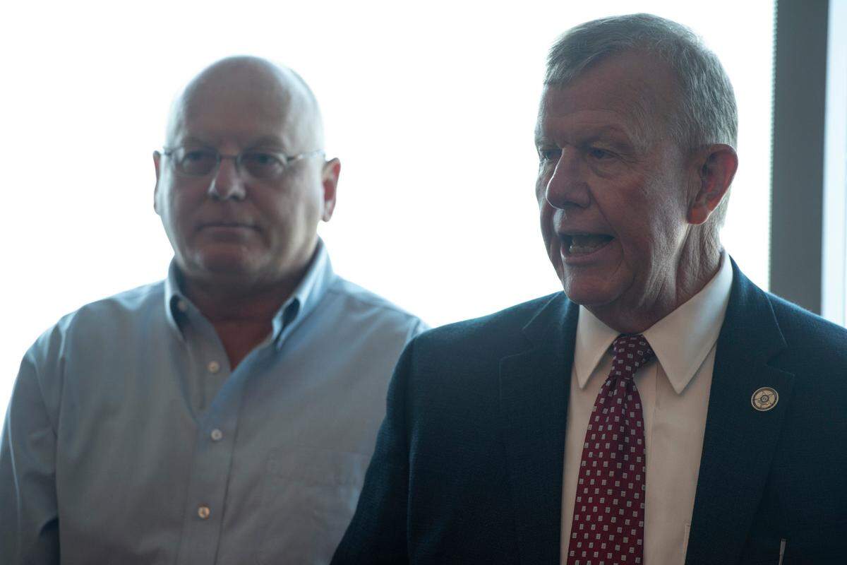 Jackson County Sheriff Mike Ezell, right, who will face off with incumbent Rep. Steven Palazzo for the Republican nomination for a congressional seat, talks to the media during an Ezell campaign press conference at the Great Southern Club in Gulfport on Thursday, June 9, 2022.