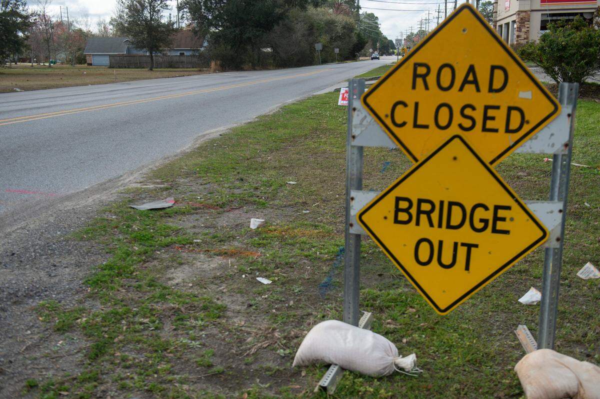 A car drives along Hanshaw Road in Ocean Springs on Monday, March 10, 2025. The road is closed between Cabildo Place Avenue and Old Spanish Trail.