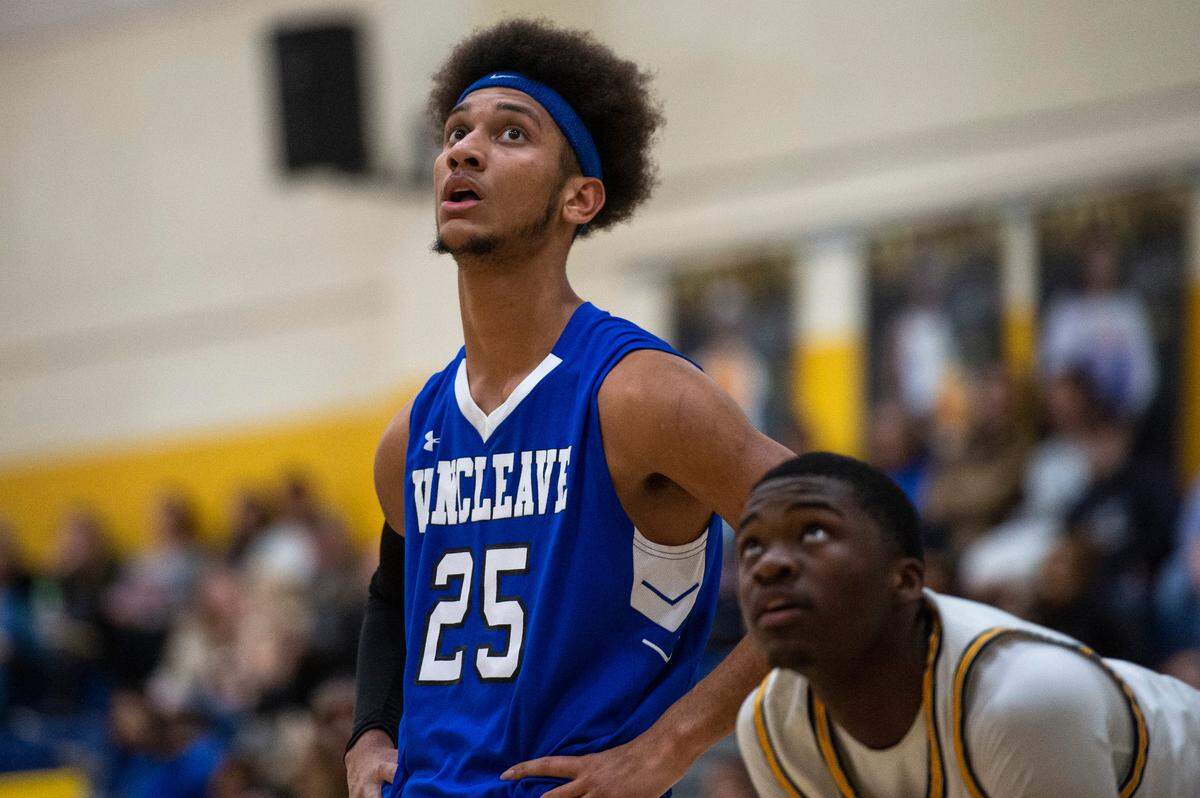 Vancleave forward Oscar Hampton, left, watches a free throw during a game against Gautier at Gautier High School in Gautier on Friday, Jan. 21, 2022.