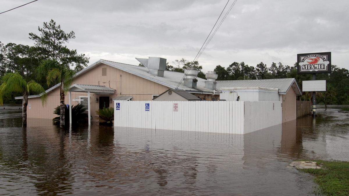 JOHN FITZHUGH/SUN HERALD 
 The Jourdan River Steamer in Kiln sits in flood waters on Thursday Aug. 30, 2012 after rain from Hurricane Isaac caused flooding in the area.