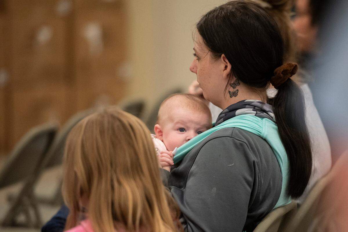 Expecting families and new mothers listen to speakers during a community baby shower event at Lyman Community Center in Gulfport on Thursday, Nov. 14, 2024.