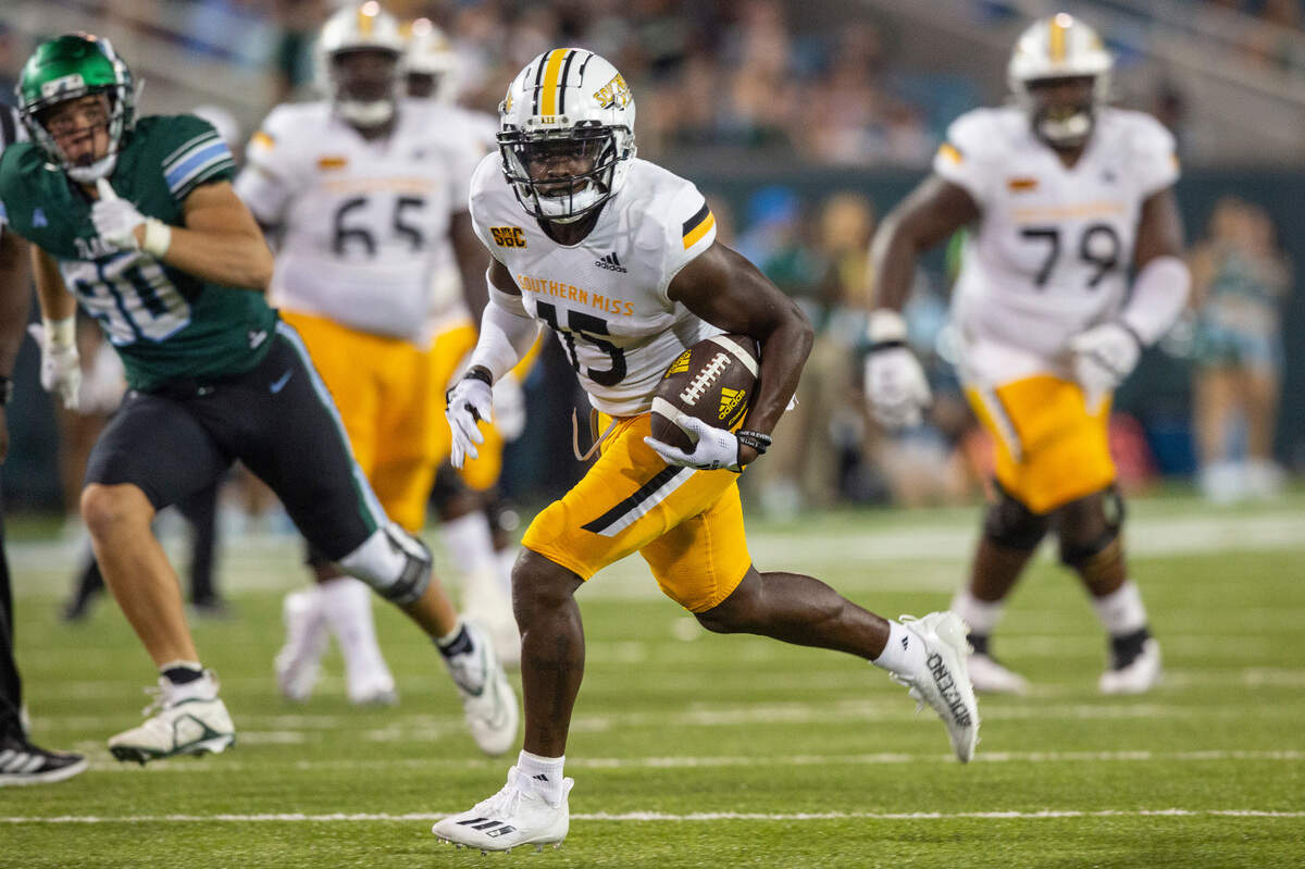 Southern Miss Golden Eagles wide receiver Jakarius Caston (15) runs the ball in for a touchdown against Tulane at Yulman Stadium in New Orleans on Saturday, Sept. 24, 2022.