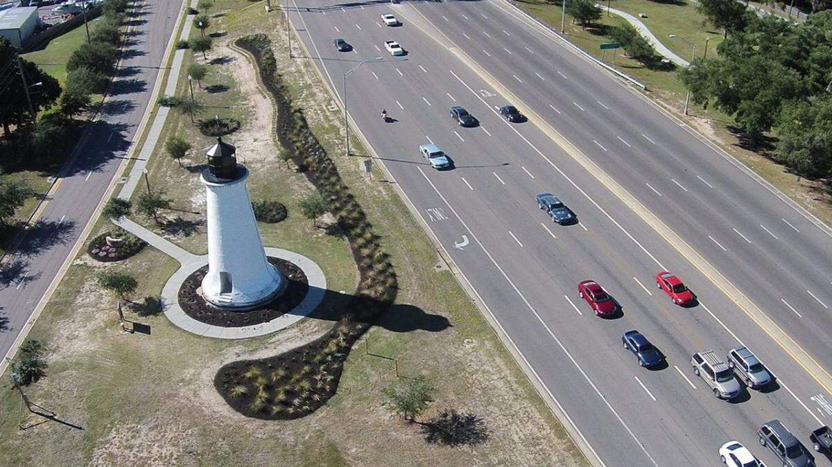CITY OF PASCAGOULA 
 Looking toward the Pascagoula River from the air, the Round Island Lighthouse sits at the foot of the high-rise bridge on U.S. 90, at the west entrance to the city.