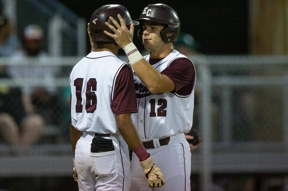 East Central’s TJ Dunsford embraces Anthony Tanner after they score in the 5A South State championship game at East Central High School in Hurley on Tuesday, May 23, 2023.