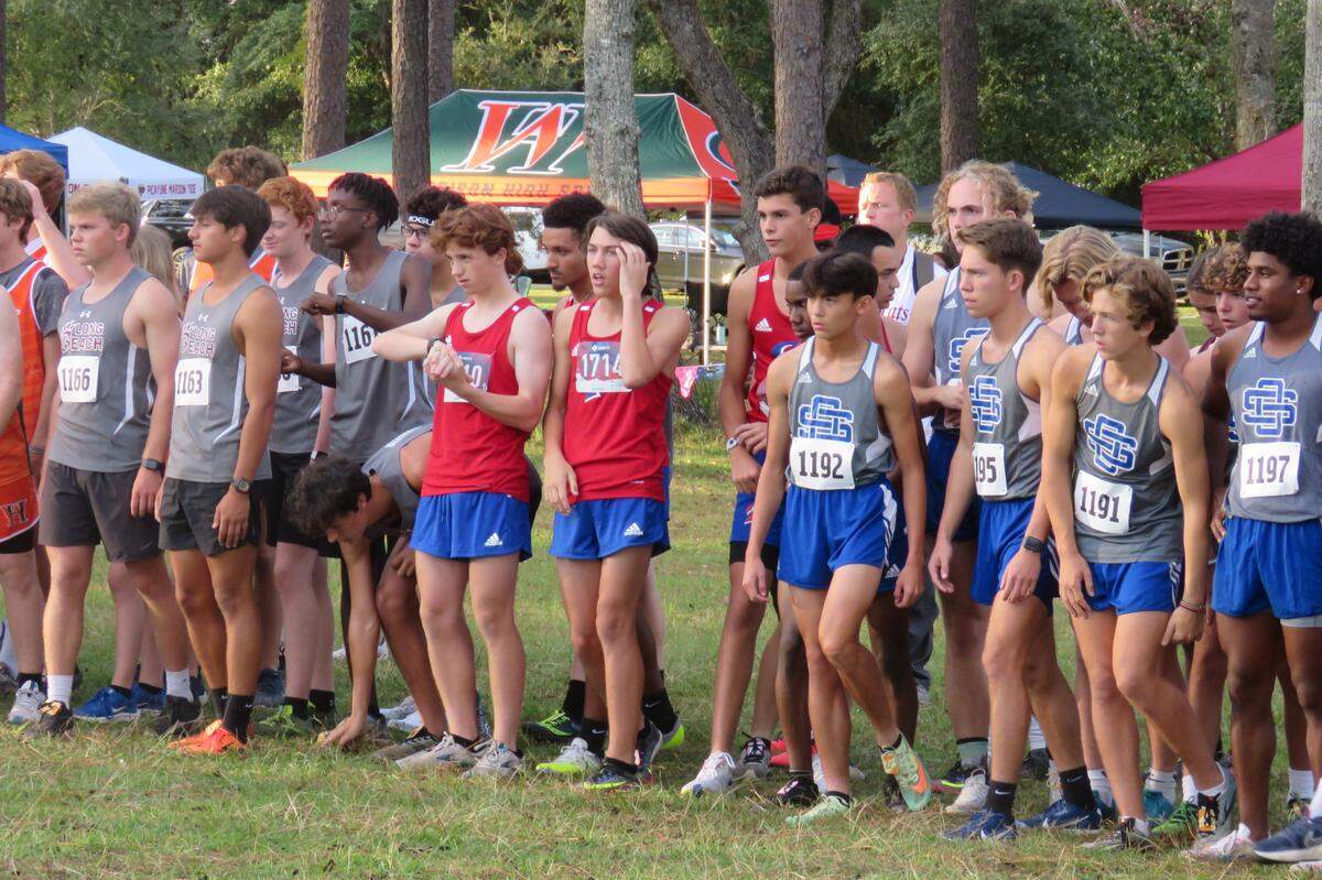 The Pascagoula High School boys cross country team stands at the starting line of the regional cross country meet on Oct. 26, 2021.