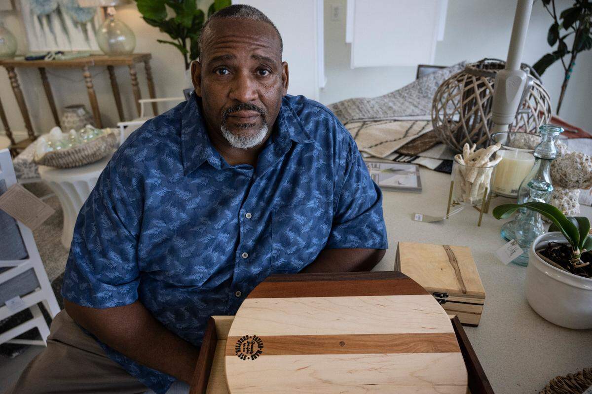 Ernest Taylor, a Bay St Louis resident who owns Taylor Made Creation woodworking business, sells his wares at Midtown Pharmacy and Gifts on Tuesday, April 12, 2022.
