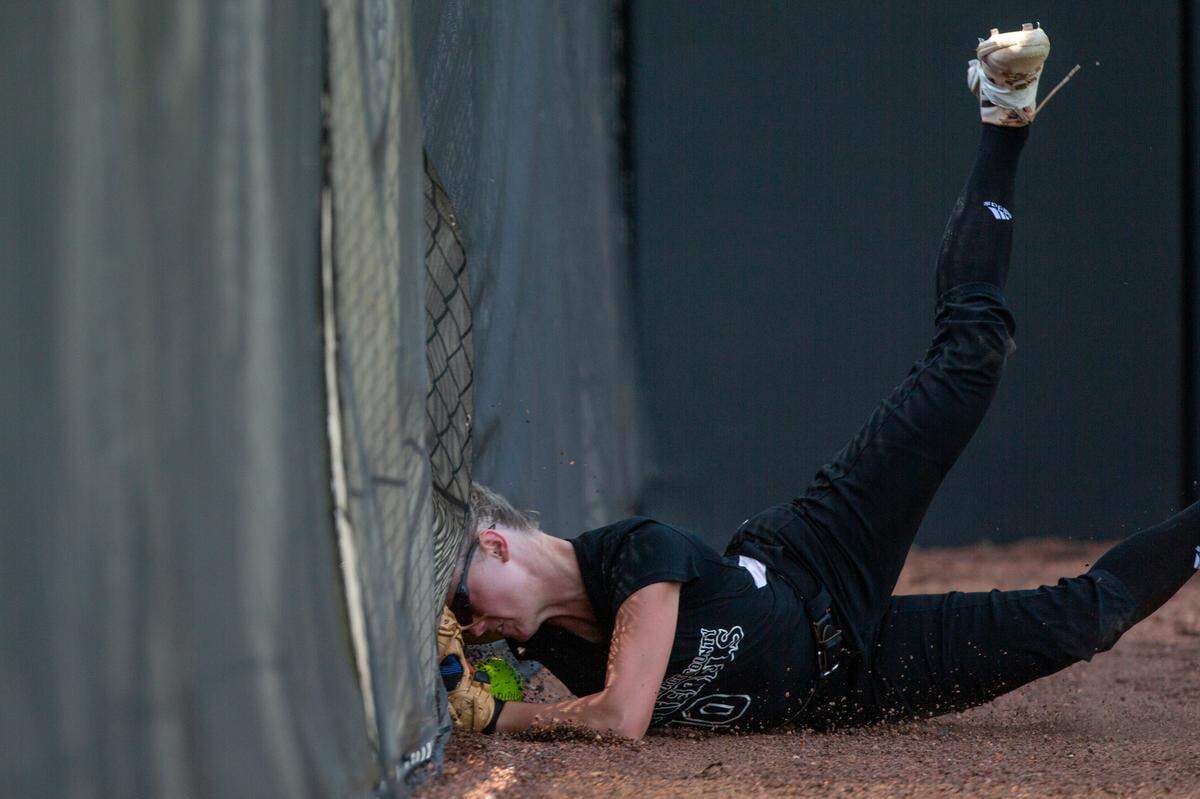 George County Lady Rebels’ Ashton Fairley runs into a fence during the 5A 2023 MHSAA Softball Championship game at USM Softball Complex in Hattiesburg on Thursday, May 18, 2023.