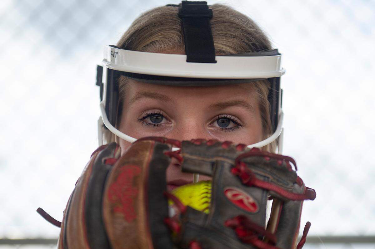 Hancock High School softball pitcher Teegan DeWitt poses for a portrait with her ball and glove at Hancock County Sports Complex in Kiln on Wednesday, July 13, 2022.