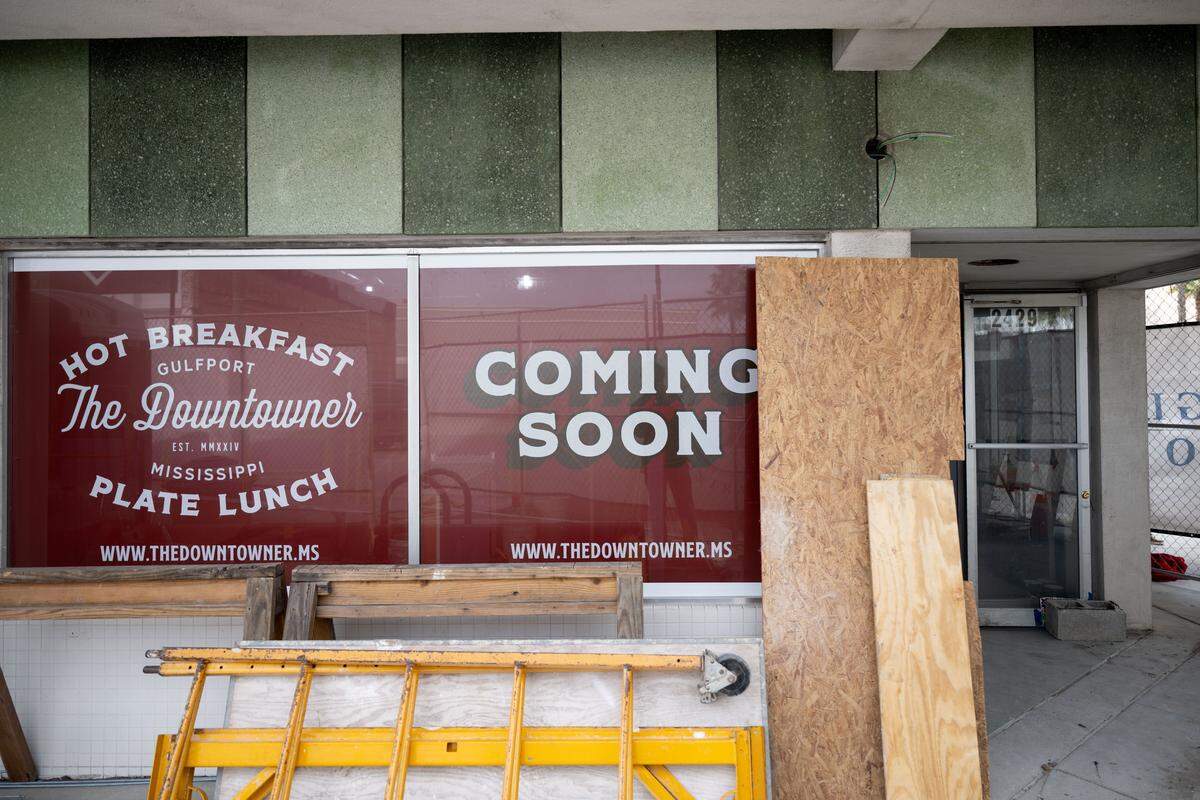 A sign at the former Triplett-Day pharmacy and lunch counter shows The Downtowner restaurant is coming soon.