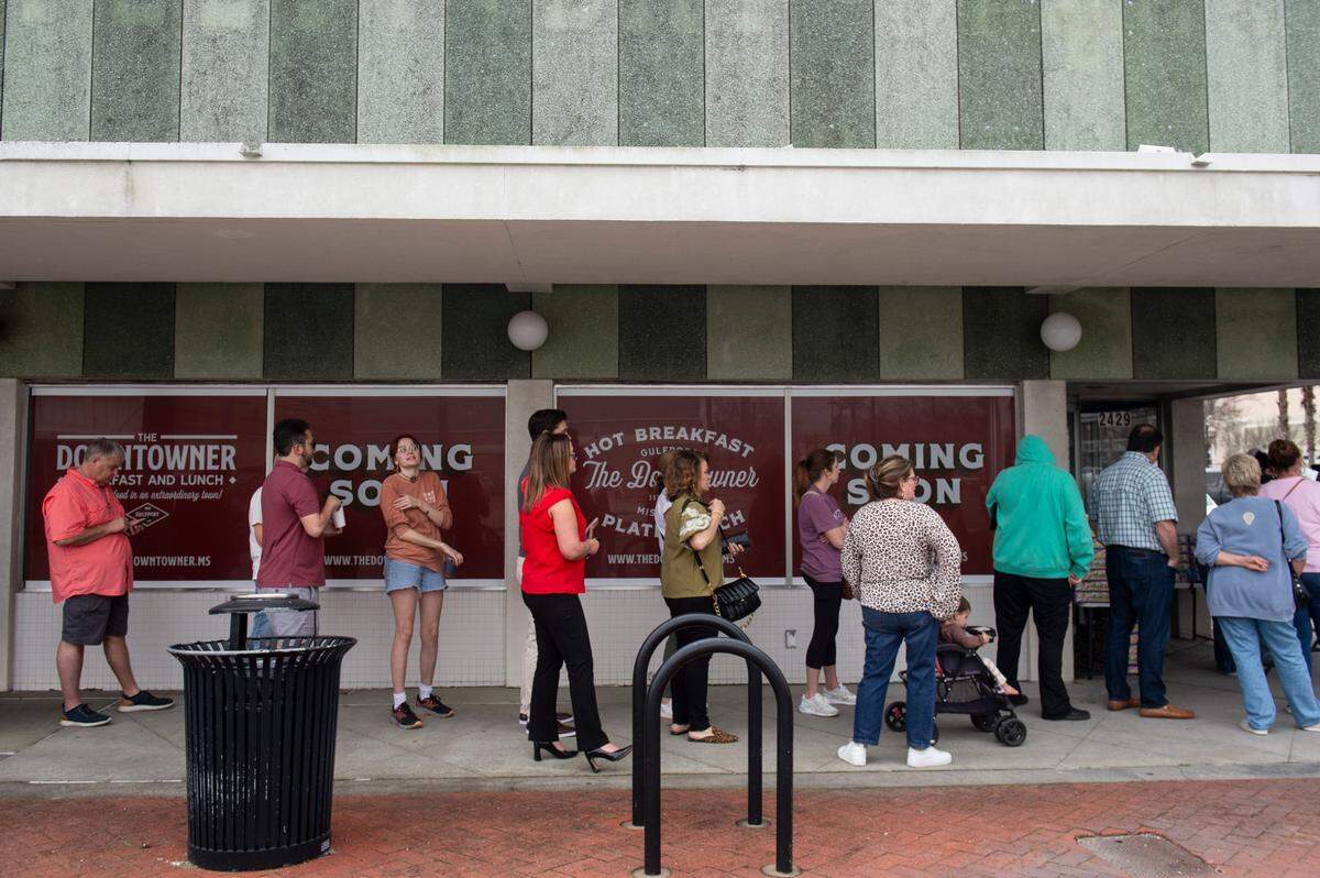Customers line up to buy Loblolly Bakery king cakes during a pop-up sale in Gulfport on Friday, Feb. 7, 2025.