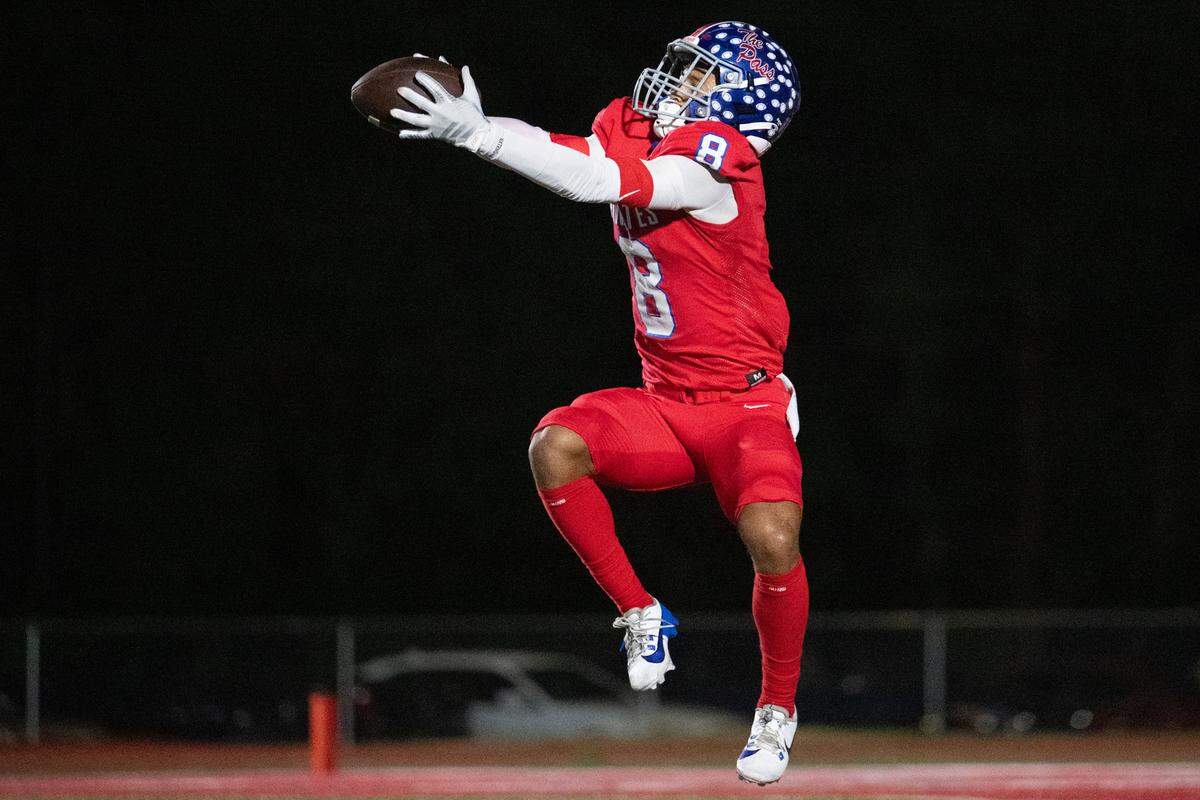 Pass Christian wide receiver Larkin Lewis (8) hauls in a TD pass Friday in a win over South Pike.