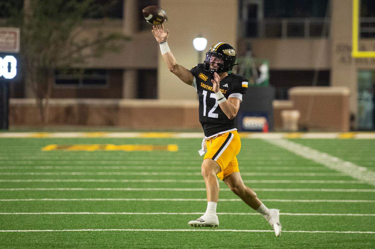 Southern Miss Golden Eagles quarterback John White (12) throws a pass during a game between Southern Miss and South Florida at M.M. Roberts Stadium in Hattiesburg on Saturday, Sept. 14, 2024.