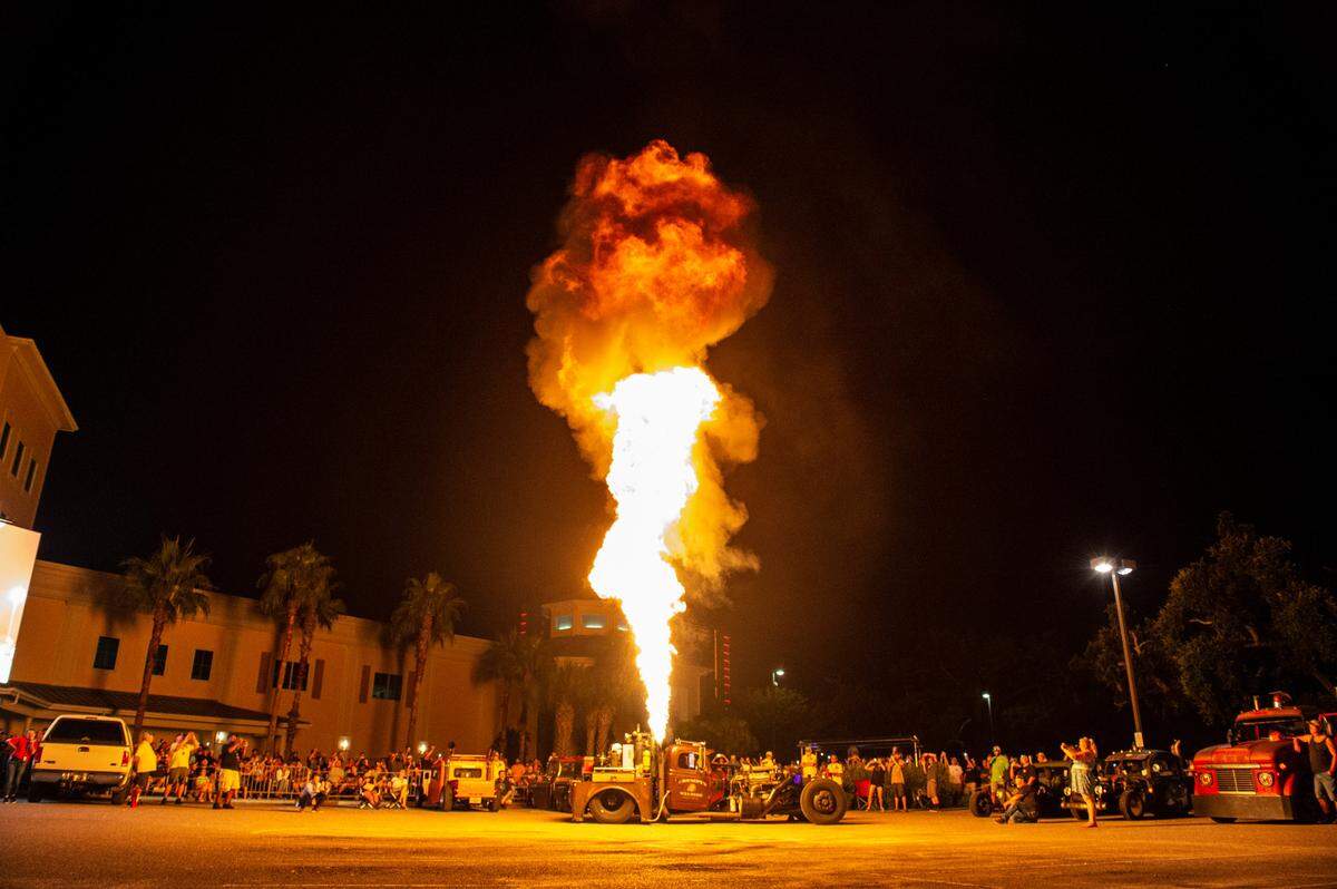 Mike “Grumpy” Chrostowski’s 1941 Dodge WF-31 emits a huge flame during a flame throwing competition, where drivers compete to see which car can produce the biggest flames, at Island View Casino in Gulfport during Cruisin’ The Coast on Tuesday, Oct. 5, 2021.