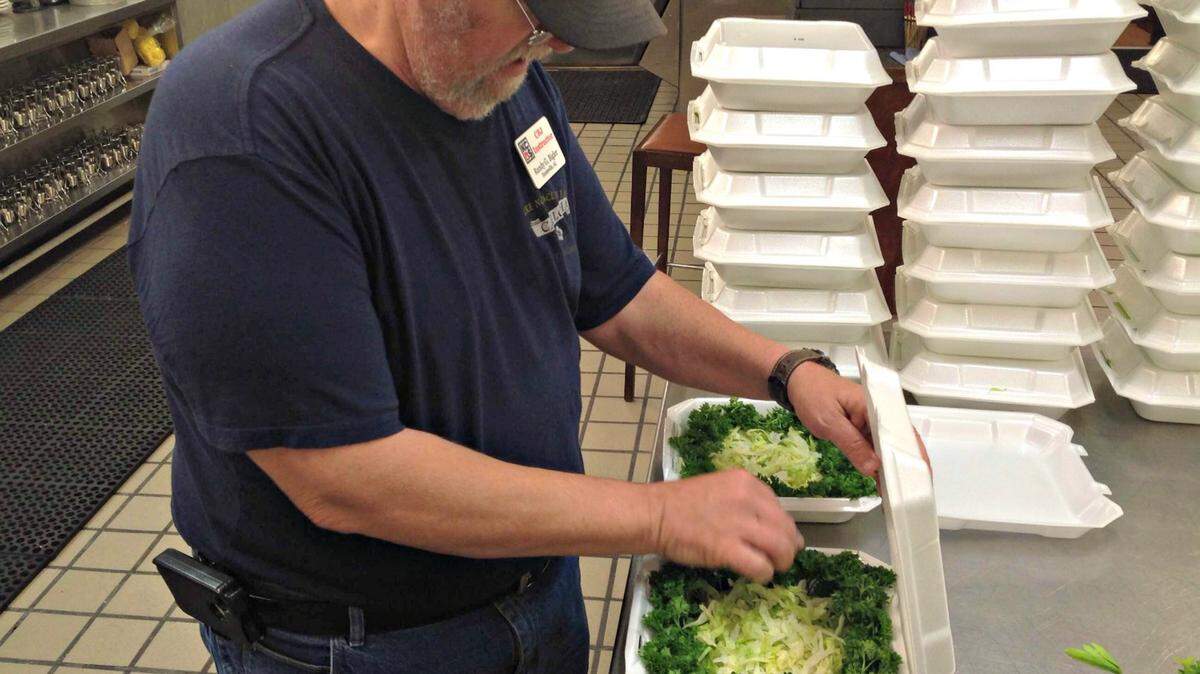 MARY PEREZ/SUN HERALD 
 While Carole Bigler was teaching a judge's class Thursday at Island View Casino, Randy Bigler was preparing the boxes for the chicken, ribs and brisket they had the chance to judge for flavor and appearance. This was among the preparations for this weekend's 'Que at the View barbecue competition on the grounds of the Island View.