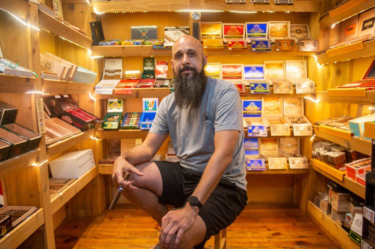 Cigars in the Pass owner Clifton Williams poses for a portrait inside a room within his business where all the cigars are stored at Cigars in the Pass in Pass Christian on Tuesday, June 27, 2023.