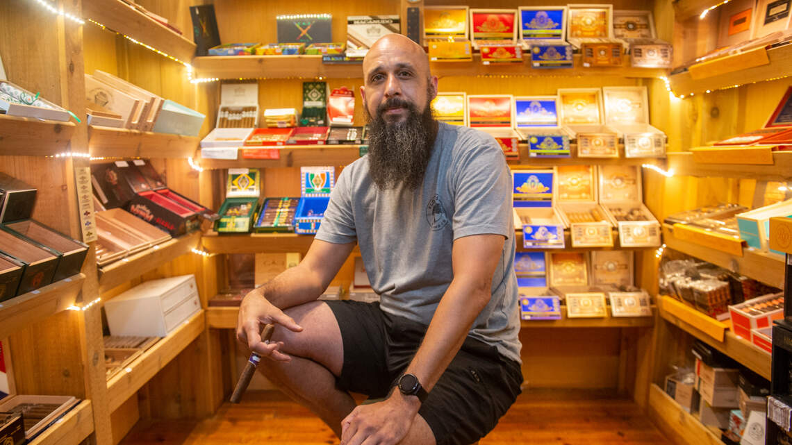 He found a love for cigars in the Navy. His popular Mississippi Coast shop welcomes all.