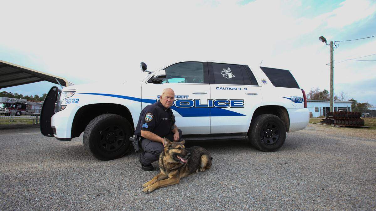 JUSTIN MITCHELL/SUN HERALD 
 Gulfport Sgt. Wayne Payne poses with his K9 officer, Paco, on March 3, 2016. A Gulfport pet sitter is raising funds to provide a bulletproof vest for K9 officers.