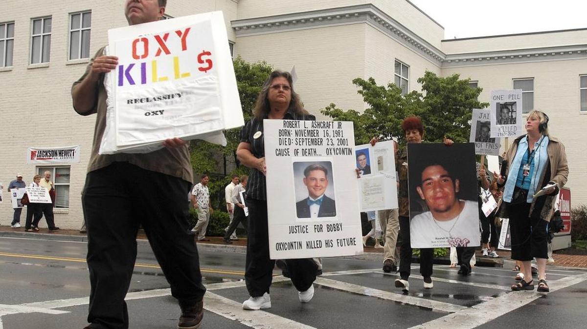In this Friday, July 20, 2007 file photo, demonstrators march along Main Street in Abingdon, Va., to raise awareness about the abuse of OxyContin. From 2000 to 2016, prescription opioid abuse has claimed the lives of 165,000 Americans, according to federal estimates.