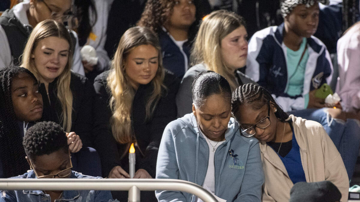 Family, friends and community members attend a candlelight vigil in honor of three Gautier High School graduates at Gautier High School on Thursday, Dec. 7, 2023. Se’Dhari Saniya Watson-Person, Kyla “Muffin” Watkins, and Tatyanna Richmond were involved in a fatal crash on Tuesday, leading to the deaths of Watson-Person and Watkins. Richmond remains hospitalized.
