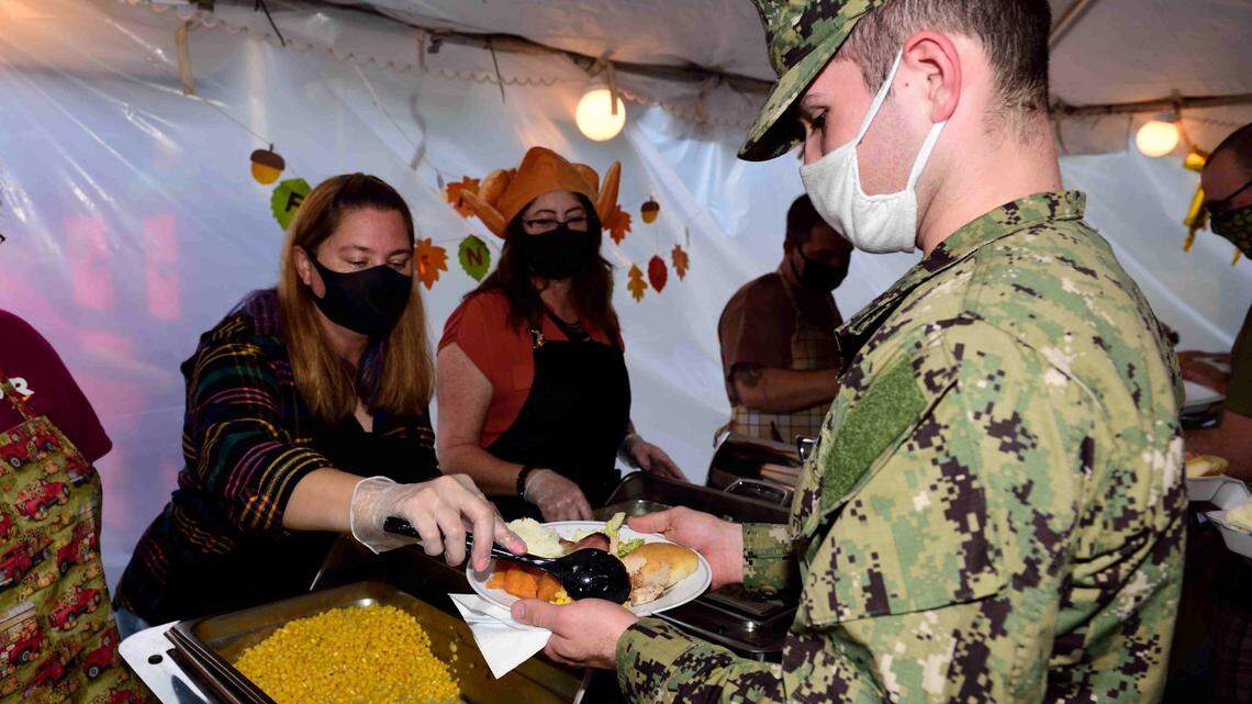 They can’t go home for turkey, so the Coast brings the holidays to sailors and airmen