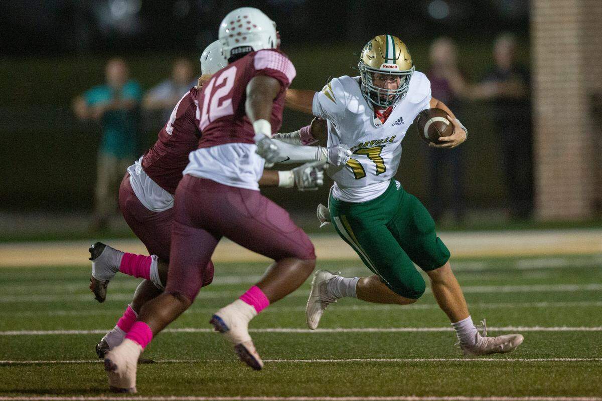 Poplarville quarterback Matt Will gets sacked by Lawrence County during a game against Lawrence County at Poplarville High School in Poplarville on Friday, Oct. 7, 2022.