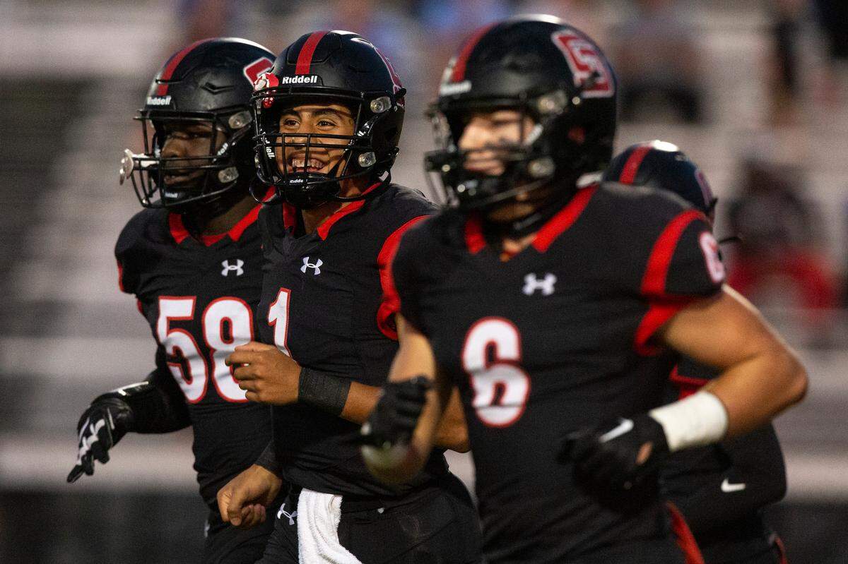 The St. Stanislaus Rock-a-Chaws take the field for a game against the Stone Tomcats at St. Stanislaus High School in Bay St. Louis on Friday, Sept. 29, 2023.