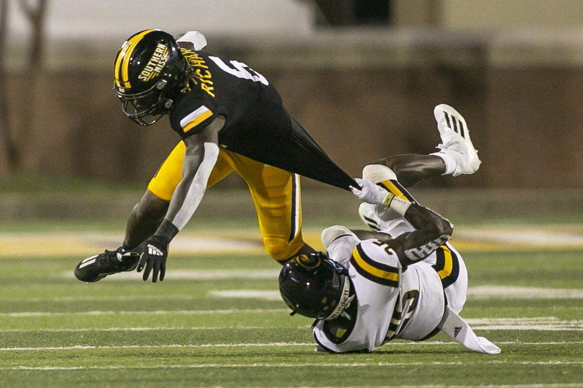 Southern Miss’s Dajon Richard is tackled by Grambling State’s Devanir Martin during the Southern Miss versus Grambling State game on Saturday, Sept. 11, 2021.