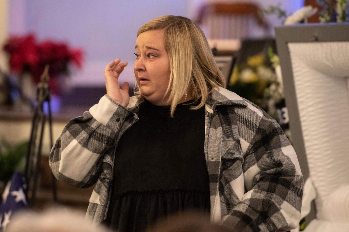 Branden Estorffe’s girlfriend Madison Bartlett reacts after saying her final goodbye before the casket is closed during the funeral of Bay St. Louis police officers Sgt. Steven Robin and Branden Estorffe at the Bay St. Louis Community Center in Bay St. Louis on Wednesday, Dec. 21, 2022. Robin and Estorffe were killed responding to a call at a Motel 6 on Dec. 14.