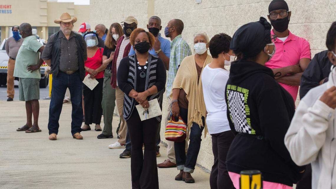 First day of early voting sees hours-long lines, down machines across Georgia